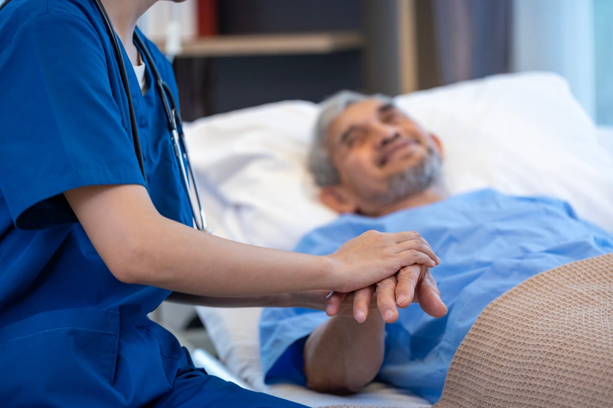 Senior patient receiving a medical service visit from nurse